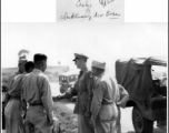 Gen. Wedemeyer shakes hand with soldiers during visit at Zhijiang air base.  In the CBI during WWII.