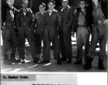 10th Air Force bomber crew during WWII. The aircraft in the background is a B-24 or B-29 bomber.