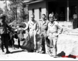 GIs and local farmer with ox cart at barracks area in Yangkai, Spring 1945. Unknown, Bill Bryan, Richard Hill, Clayton E. "Fred" Nash, Aspinwall, Gilliland, Alexander, Chisholm.