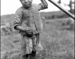 A close-up of the boy in the paddy at the foot of our area, Yangkai, China 1944.