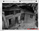 HQ in a cave in Guilin, Guangxi, China, with Chinese guard standing watch.