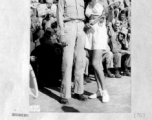 Lt. Earle Meadows, former Olympian and USC pole vault champ, poses with Jinx Falkenburg, movie star, in China during WWII.