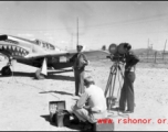 An American GI being filmed in front of a P-51. From the collection of Hal Geer.