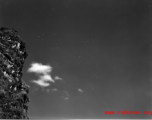 B-25 Mitchell bombers in flight over southern China, with a Karst mountain in the foreground.