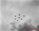 A formation of B-25 Mitchell bombers above in flight in the CBI, in the area of southern China, Indochina, or Burma.