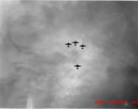 B-25 Mitchell bombers in flight in the CBI near an American air base, in the area of southern China, Indochina, or Burma. During WWII.