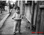 A little boy on the street in Yunnan, China, during WWII.