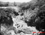 A dam and and falls about 8 miles southeast of the Luliang air base area in Yunnan province, China, where the GIs went to swim and relax. During WWII.