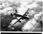 B-24s in flight in the CBI during WWII, including "The Goon" (tail #124183) in the top image.