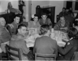 Celebrities visit and perform at Yangkai, Yunnan province, during WWII: GIs and medical staff share a meal with celebrities, including Betty Yeaton.