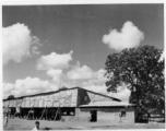 Covered theater area in India.  Scenes in India witnessed by American GIs during WWII. For many Americans of that era, with their limited experience traveling, the everyday sights and sounds overseas were new, intriguing, and photo worthy.