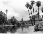 Ornate building on manicured grounds.  Scenes in India witnessed by American GIs during WWII. For many Americans of that era, with their limited experience traveling, the everyday sights and sounds overseas were new, intriguing, and photo worthy.